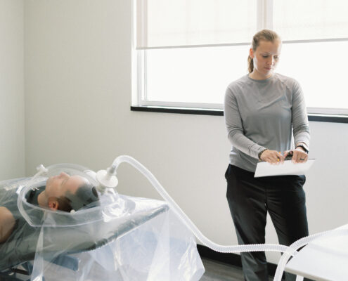 Person completing a Resting Metabolic Rate (RMR) assessment at Proximal50 in Bismarck, ND to measure resting metabolism and calorie expenditure.